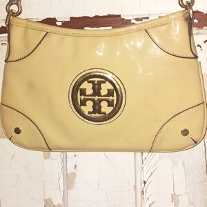 Cream Tory Burch crossbody handbag.